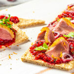 Smoked Duck on black pepper flatbread, BC Raspberry compote appetizer